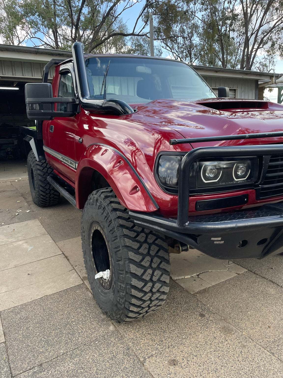 Red Land Cruiser with custom fabrication